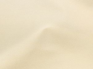 Nahaufnahme von einem Outdoorstoff mit gewebtem Muster in der Farbe creme