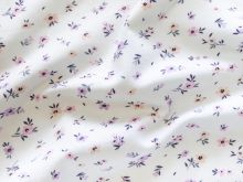 Nahaufnahme von Jersey Digitaldruck - kleine Blümchen - wollweiß